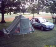 MG Maestro 1600 parked next to a tent full of spares