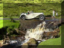 Jerry Birkbeck crossesthe Herriot watersplash near Langthwaite