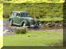 Neil Cairns crossesthe Herriot water splash  near Langthwaite